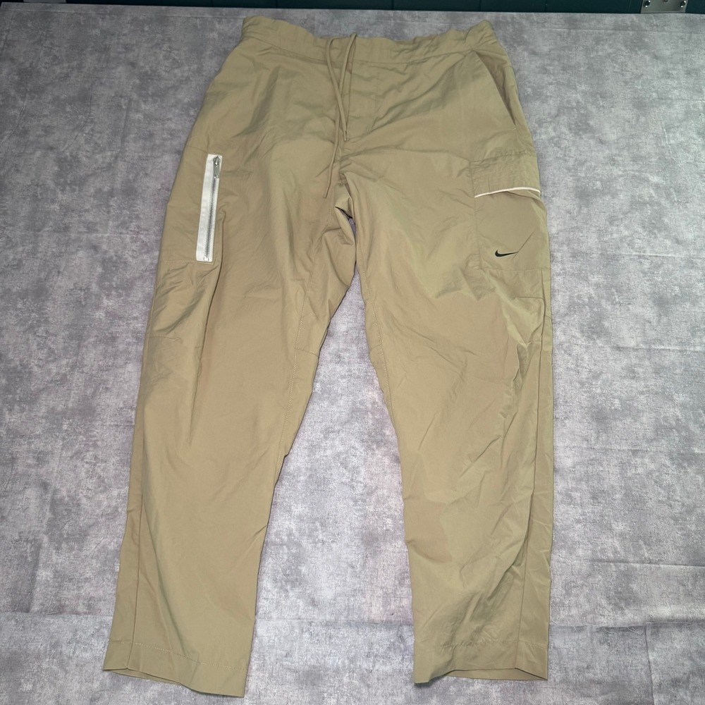 Nike Mens Woven Cargo Pants Khaki Tan Drawstring Utility Tapered Size 34 L